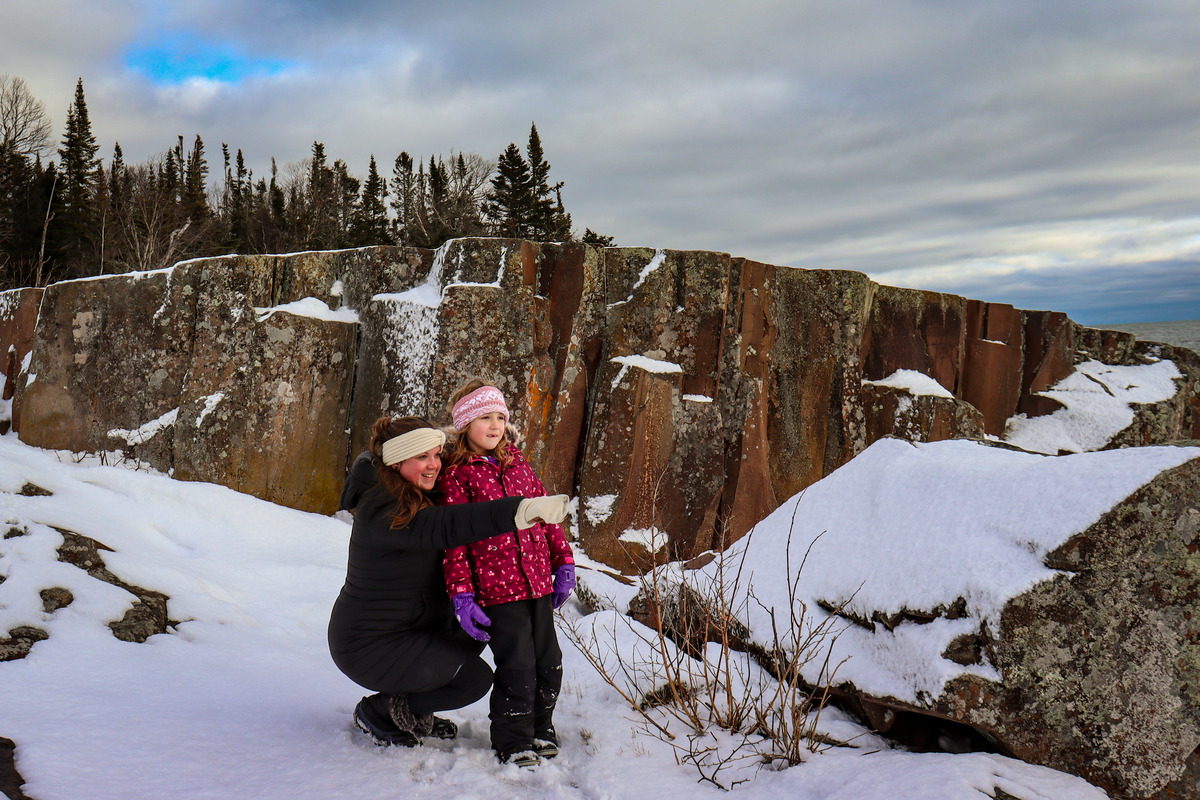 A mom and her young daughter enjoy a snowy outing in Minnesota.