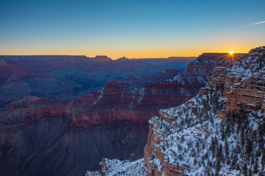 The Grand Canyon dusted with snow, one of the best winter vacations for families.