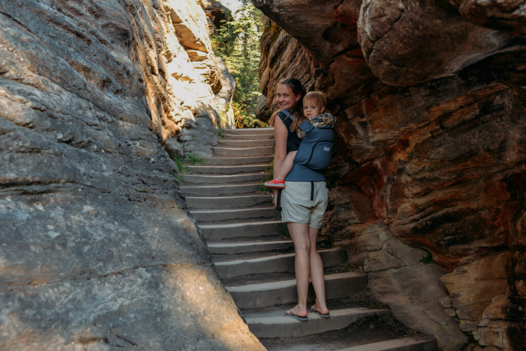 A mom and her baby climbing stairs at Athabasca Falls in Jasper National Park